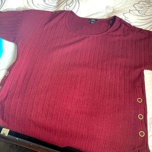 Deeper wine color in person, pretty new worn once! Fancy feeling material.